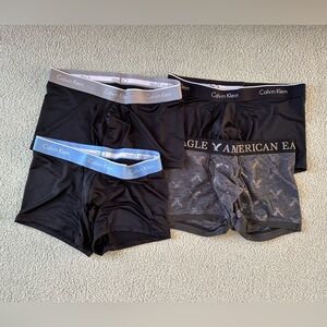 Men’s Boxer Briefs - 4 PACK - Calvin Klein are Size L, American Eagle is Size M.
